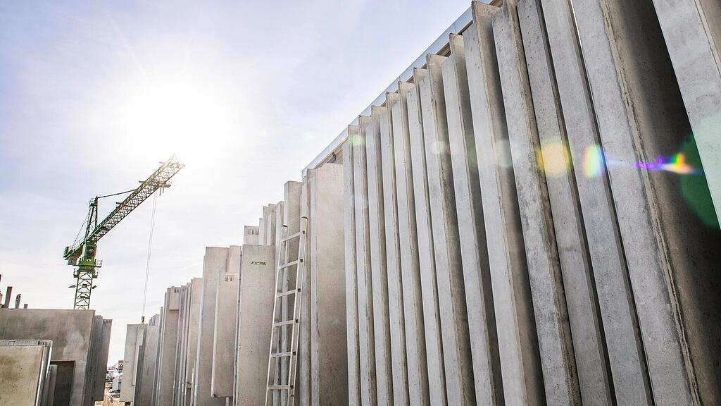 Concrete walls standing vertically on a construction site.